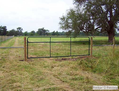 Field fence with five inch round posts and 4x4 wire