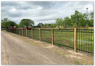 Five foot wrought iron fence with 6x6 wood posts