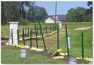 Installing poles for field fence