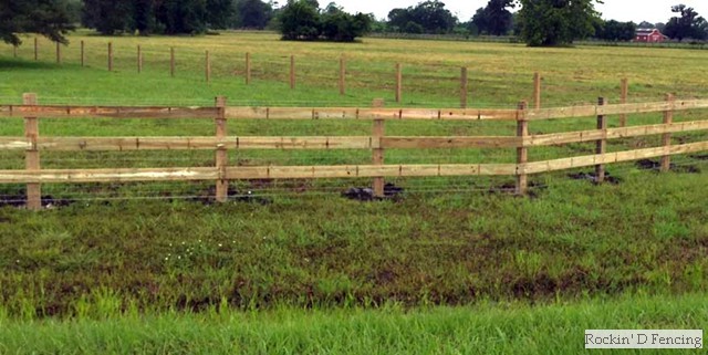 Three rail horse fence with wire