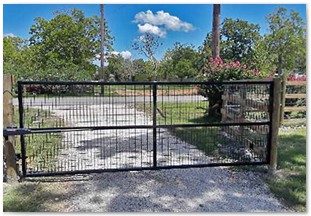 Black drive through gate with automation