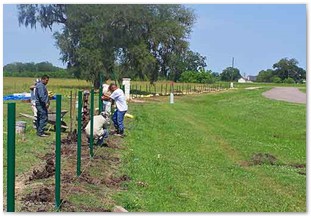 Installing field fence alongside roadway