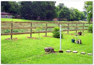 Three rail horse fence with cattle panel