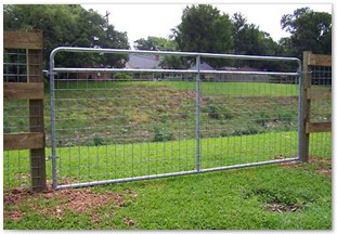 Three rail horse fence with cattle panel and galvanized swing gate