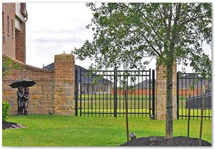 Decrotive wrought iron fencing and gateway with wingstones in Whispering Lakes